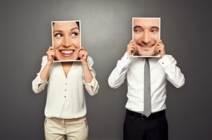 man and woman holding glad faces